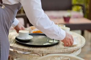 Helping a waiter clear the table looks kind but psychologists say it reveals something deeper 1024x683